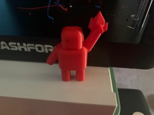 robot holding a crystal (on a stand)